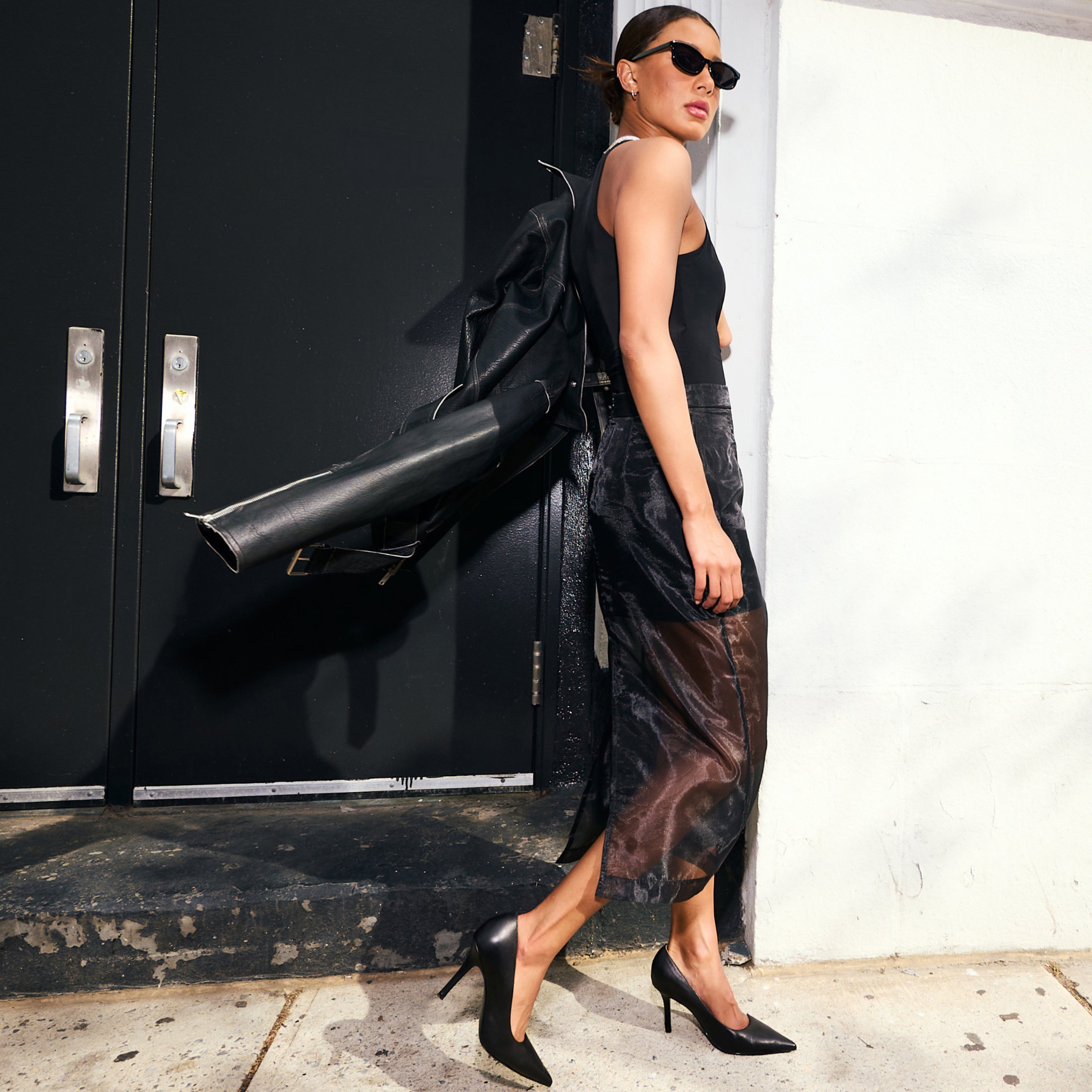 Editorial banner featuring model wearing pumps
