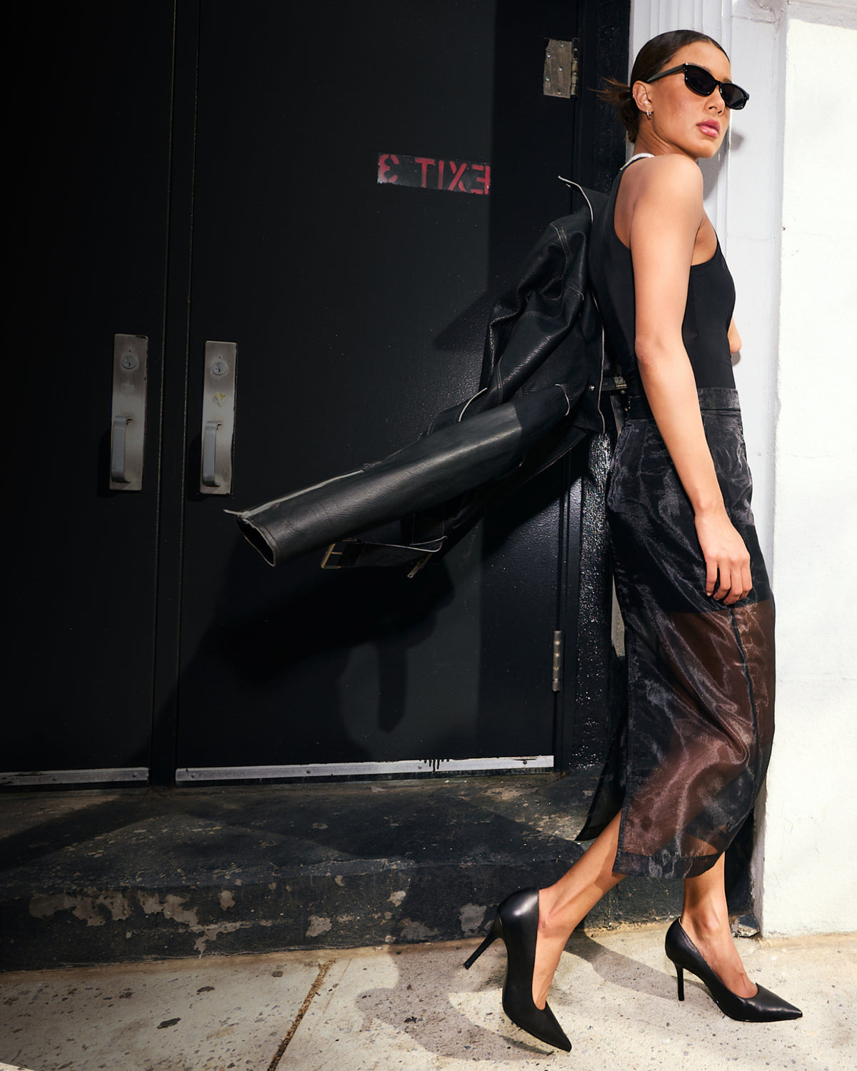 Editorial banner featuring model wearing genuine leather pumps