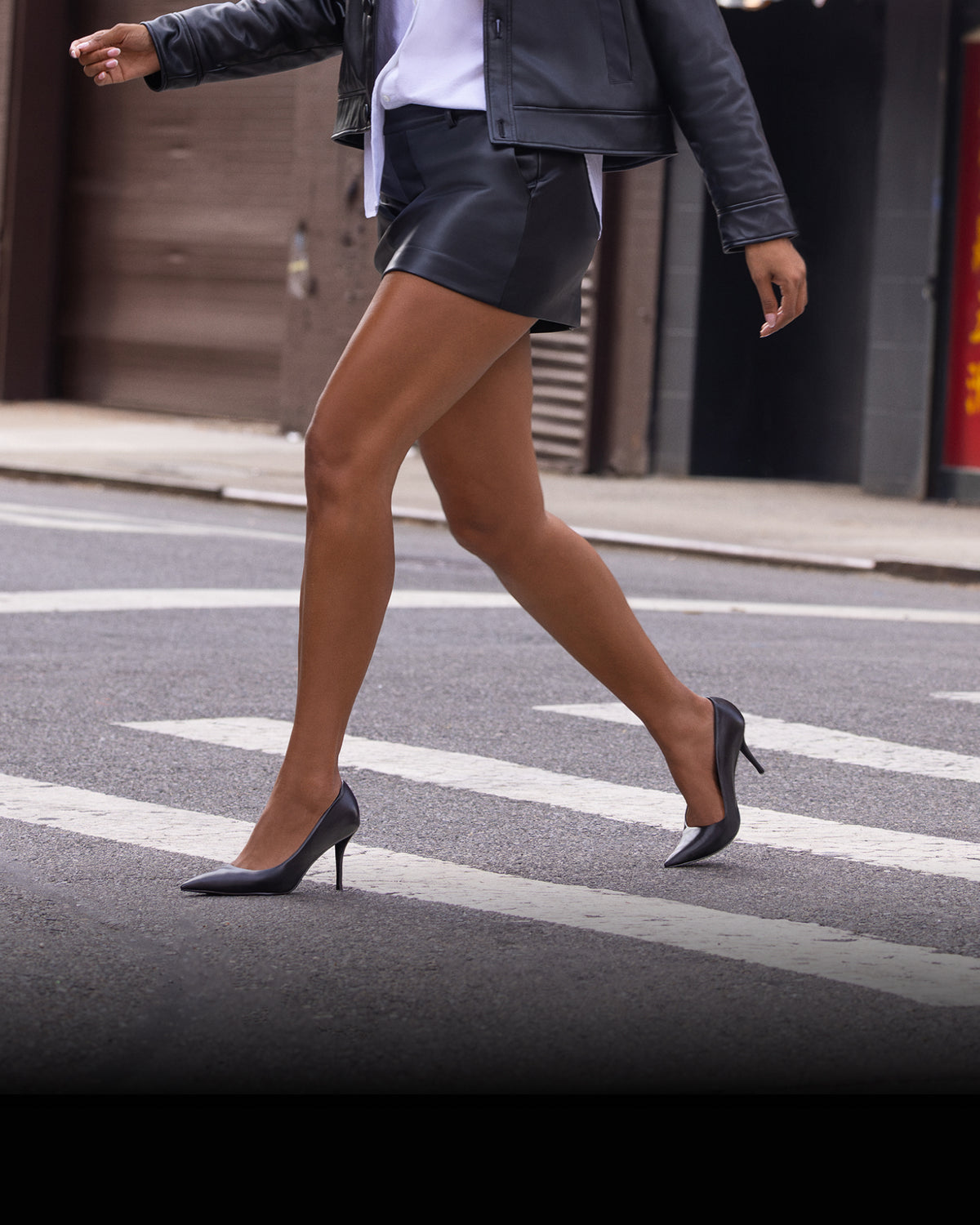 Editorial banner featuring model wearing Merran leather pumps