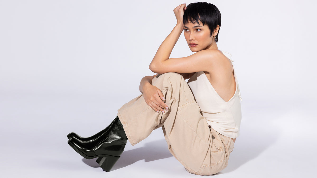 Editorial banner featuring model wearing booties style