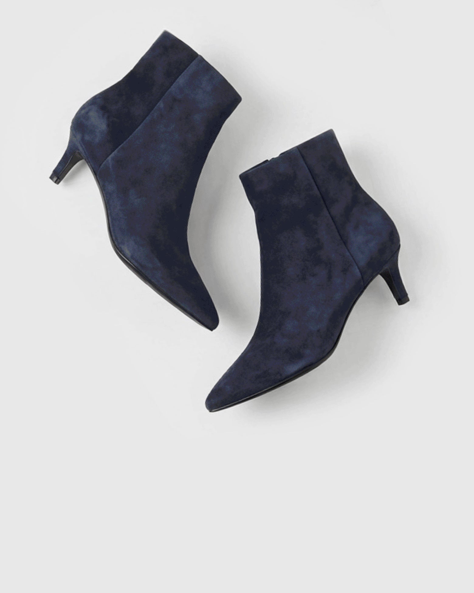 Editorial banner featuring navy suede styles